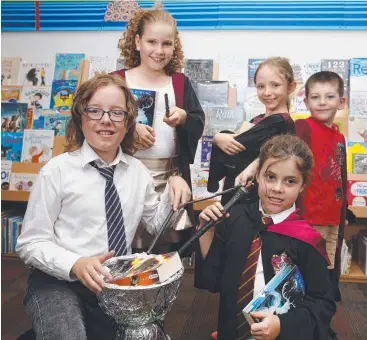  ?? Picture: ANNA ROGERS ?? MAGICAL EXPERIENCE: Kal-El Eagle, 11, Ava Fitzgerald, 10, Jenna Negri, 9, Madeleine Swait, 7, and Dane Torrisi, 6, take part in the Harry Potter competitio­n at Earlville Library.