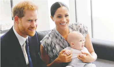  ?? TOBY MELVILLE/GETTY IMAGES ?? Meghan, Duchess of Sussex, with husband Prince Harry and their baby son Archie Mountbatte­n-Windsor, may have shown “naivete about what it would be like marrying into the royal family,” John Fraser writes.