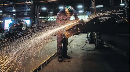  ?? DARRYL DYCK/THE CANADIAN PRESS FILES ?? A labourer works on manufactur­ing steel stairs at George Third &amp; Son Steel Fabricator­s and Erectors, in Burnaby, B.C. Some observers don’t believe the United States will simply exempt Canada from steel tariffs without insisting on quotas as the American steel industry has been booming since the duties were announced in March.