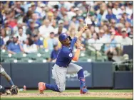  ?? John Fisher / Getty Images ?? The Mets’ Francisco Lindor strikes out in the seventh inning against the Brewers at American Family Field on Sunday in Milwaukee.