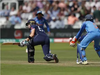  ?? (Getty) ?? Lauren Winfield loses her wicket by India's keeper Sushma Verma