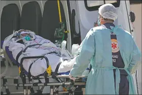  ?? (AP/Eraldo Peres) ?? A patient suspected of having covid-19 is received at the HRAN Hospital in Brasilia, Brazil.