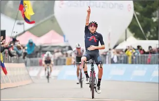  ??  ?? Britain’s Tao Geoghegan Hart celebrates as he crosses the finish line to win the 15th stage of the Giro d’Italia cycling race from Rivolto to Piancavall­o, Italy on Oct 18. (AP)