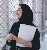  ?? Victor Besa and Reem Mohammed / The National ?? Top, Buthaina Al Qubaisi, one of the first women to register at the centre in Abu Dhabi Chamber of Commerce and Industry Building. Above, a candidate is briefed on the FNC elections; Latifa bin Suwaidan, left