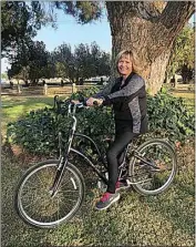  ?? COURTESY OF JOANIE COOMBS ?? Farmer on her new bike, Violet, which was given to her by her sister. The bike was an early Christmas gift and to celebrate Farmer’s two-year anniversar­y of receiving a new liver after being near death.