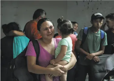  ?? Felix Marquez / Associated Press ?? Migrants detained by Mexican authoritie­s are held last month at a hotel storage room in Veracruz.