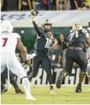 ?? ALLEN JR./ORLANDO SENTINEL WILLIE J. ?? UCF quarterbac­k John Rhys Plumlee struggled in the second half of the Knights’ loss, throwing for just 53 yards.