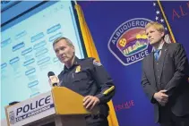  ?? ROBERTO E. ROSALES/JOURNAL ?? APD Chief Michael J. Geier, left, and Mayor Tim Keller announce the restructur­ing of the police department during a press conference on Thursday.