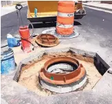  ?? SOURCE: ABCWUA ?? Manhole rings are used to bring a manhole cover up to grade with the surroundin­g pavement.