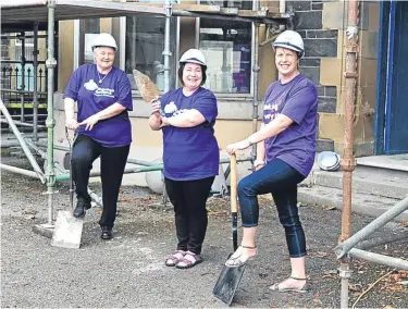  ??  ?? ■
Ready to get working! Clare, middle, at Cromarty House with Alzheimer Scotland volunteers Linda Thompson, left, and Rhoda Kelly.