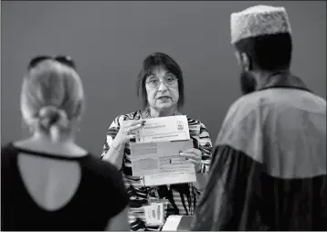  ?? ASSOCIATED PRESS ?? IN THIS WEDNESDAY PHOTO, Maricopa County Elections official Joanne Tillson instructs election volunteers during a training session in Phoenix.