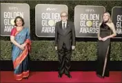  ?? Todd Williamson NBC/NBCU Photo Bank via Getty Images ?? MEHER Tatna, left, Ali Sar and Helen Hoehne of the Hollywood Foreign Press Assn. at Sunday’s event.