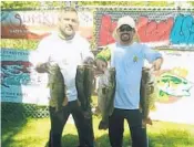  ?? MIKE LENDL/COURTESY ?? Michael and Anthony Katzelnik caught five fish weighing a total of 21.33 pounds Sunday to win the fifth King of the Glades open team bass tournament trail qualifier out of Everglades Holiday Park.