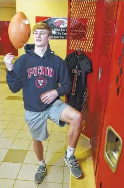  ?? STAFF PHOTO BY TIM BARBER ?? Malone Howley, who played football for the first time last season, wears a Penn University hoodie in the locker room at Signal Mountain.
