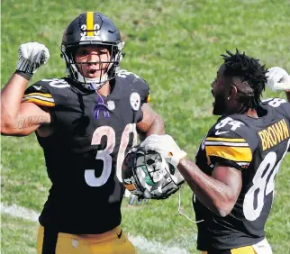  ?? GENE J. PUSKAR/THE ASSOCIATED PRESS/FILE ?? Steelers players James Conner and Antonio Brown aren’t the only ones celebratin­g after seven NFL weeks; ratings and viewership are strong.