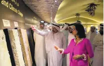  ?? Duncan Chard for The National ?? Prof Abdulrahma­n Alsharhan, ICBA chairman, centre, and Dr Ismahane Elouafi, ICBA director general, at the opening yesterday of the Emirates Soil Museum in Dubai.