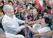  ?? Gary Coronado Los Angeles Times ?? PRESIDENTI­AL front-runner Andres Manuel Lopez Obrador greets supporters. The vote is July 1.