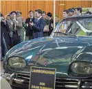  ?? PROVIDED BY LIONSGATE ?? Onlookers at the 1963 Geneva Auto Show applaud the unveiling of the Lamborghin­i 350 GT in “Lamborghin­i.”