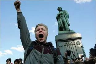  ?? Carl Getty / Getty Images ?? A demonstrat­or shouts antigovern­ment slogans in downtown Moscow last Sunday. Thousands crowded into Moscow’s Pushkin Square on Sunday for an unsanction­ed protest against the Russian government.