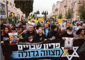  ?? Ohad Zwigenberg/Associated Press ?? Relatives and supporters of the Israeli hostages held in the Gaza Strip by the Hamas militant group leads the Purim parade in Jerusalem on Monday.