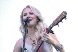  ?? Nikolas Samuels/The Signal ?? Savannah Burrows performs during Concerts in the Park at Central Park on Saturday.