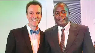  ??  ?? FOR OUR GAME . . . Former Warriors hitman Agent “Ajira’’ Sawu (right) poses for a photo with StarFM sports guru, Steve Vickers, at the inaugural Footballer­s Union of Zimbabwe awards ceremony in Harare in February this year
