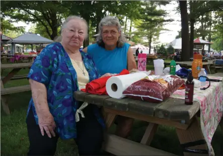  ?? FRANCINE D. GRINNELL-MEDIANEWSG­ROUP ?? Sharon LaGoy, left, of Warrensbur­g plans her vacation every year at this time to come to opening day. This year, her niece, Melanie Burkitt of Sac City, Iowa, joined her.