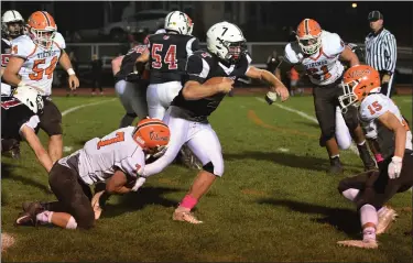  ?? AUSTIN HERTZOG - MEDIANEWS GROUP ?? Boyertown’s Jamie Moccia (7) tries for extra yardage as Perkiomen Valley’s Brendan Shayer (7) and Mike Dougherty (15) close in for the tackle.