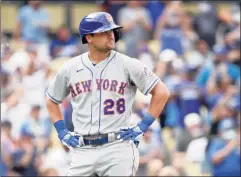  ?? Alex Gallardo / Associated Press ?? The Mets’ J.D. Davis reacts at the plate after striking out with the bases loaded during the fifth inning against the Dodgers on Saturday.