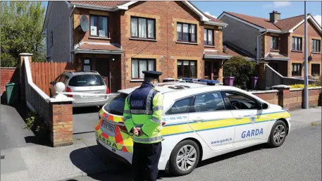  ??  ?? Gardaí on duty outside the home of the Karaczyn family at Crozon on Monday morning. Gardaí have appealed for informatio­n about the movement on Sunday morning of the family’s silver Peugeot car. Pic: Carl Brennan.