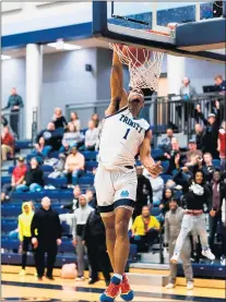  ?? PHOTO PROVIDED BY TRINITY CHRISTIAN COLLEGE ?? Junior guard James Pennington, a Thornwood graduate who led Trinity Christian in points last season, dunks the ball.