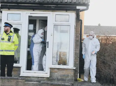  ??  ?? Forensic team carrying out an investigat­ion at Satley Gardens, Tunstall.