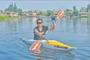  ?? WASEEM ANDRABI/HT ?? Bilques Mir kayaking in Srinagar’s Dal Lake is steering India’s quest for an Olympic medal in water sports.