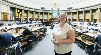  ??  ?? Debra at Manchester Central Library, where she carried out much of her research