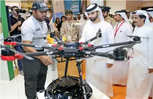  ??  ?? Sheikh Mansoor bin Mohammed bin Rashid Al Maktoum tours Dubai Helishow 2018 on Tuesday. — Wam