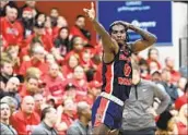  ?? David Dermer Associated Press ?? ANTOINE DAVIS of Detroit Mercy reacts after making a three-pointer against Youngstown State.