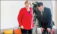 ?? AP/GEERT VANDEN WIJNGAERT ?? German Chancellor Angela Merkel and French President Emmanuel Macron, attending the European Union summit in Brussels, spoke Thursday of concern over Britain’s lack of a deal for exiting the EU.