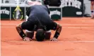  ?? Photograph: Shi Tang/Getty Images ?? Tsonga plants a symbolic kiss on the clay.