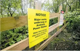  ?? Photo / File ?? Awarning sign pictured above the Aratiatia Rapids on thewaikato River near Taupo¯.