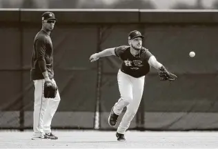  ?? Karen Warren / Staff photograph­er ?? The 2020 season for Astros outfielder Kyle Tucker, right, included slick defensive work that earned him a spot among the Gold Glove finalists and a strong finish at the plate.