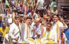  ?? PTI ?? BJP leader Tejasvi Surya (second from left) taking part in a road show at Chandni Chowk.