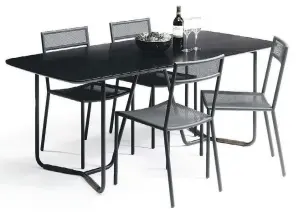  ?? SAUDER BOUTIQUE ?? The Boot Leg dining table, by Ohio furniture company Sauder, pairs a charcoal-black finish with leather-wrapped legs. “It’s like a V-neck shirt under a blazer or sport coat,” says the company’s design director.