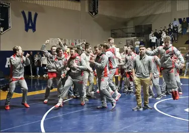  ?? BEN HASTY — READING EAGLE ?? The Hamburg wrestling team reacts after it’s announced that the Hawks defeated Exeter Friday in the BCIAA final on Criteria I, most first points scored.