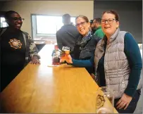  ?? Ernest A. Brown The Call ?? Beer-tender Quinn Bryan, left, shares a laugh with customers Paula Lima, center, and Mary Eckstein, both of Pawtucket, while the two enjoy brews Saturday.