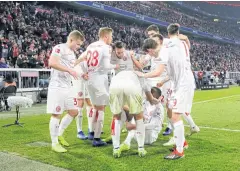  ?? EPA ?? Dusseldorf’s Dodi Lukebakio, on ground, celebrates with teammates after scoring his team’s third goal against Bayern Munich.