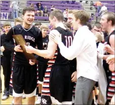  ??  ?? Blackhawks seniors Cole Wright and Matt Thomas and teammates were jubilant after winning the 4A District championsh­ip Saturday night in Berryville.