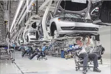  ?? THE ASSOCIATED PRESS ?? Volkswagen’s factory in Tennessee, seen above in 2013, will be the focus of an $800-million investment in the company’s manufactur­ing of electric vehicles in North America.
