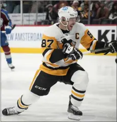  ?? DAVID ZALUBOWSKI — THE ASSOCIATED PRESS ?? Pittsburgh Penguins center Sidney Crosby reacts after scoring a goal against the Colorado Avalanche in the second period Wednesday in Denver.