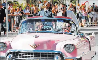  ??  ?? Enews Jesse Garon, aka the official Elvis of Las Vegas, escorted country duo Florida Georgia Line down the red carpet in his 1955 convertibl­e pink Cadillac at the 52nd Country Music Awards at T-mobile Arena.