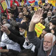  ?? AP/VAHID SALEMI ?? Demonstrat­ors in Tehran, Iran, chant Sunday during an annual rally in front of the former U.S. Embassy to mark the 39th anniversar­y of the seizure of the embassy by militant Iranian students.